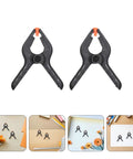 Must-Have 20-Ply Small Spring Clamps Kit For Woodworking And Photography Backdrop Clips Plus Heavy Duty Plastic Cloth Holders Perfect For Crafting, Home Improvement, Studio Work, Office Tasks, And Everyday Organization Adventures. Black plastic small spring clamps with orange tips for backdrop and craft use