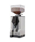 Level Up Your Home Barista Setup With This Sleek Copper And Chrome Espresso Machine Paired With A Silent Conical Burr Grinder In A Complete Bundle Crafted For Smooth Extractions And Effortless Daily Coffee Vibes - Eureka Silenzio 55 grinder with coffee beans.