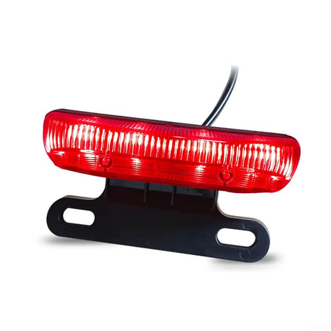 Slick E Bike Tail Light With Smart Brake Sensor For 36V To 48V Systems Ensures Your Night Rides Are Super Safe And Totally Lit For All The Commuters In Town. red ABS e bike tail light with mounting bracket and wire
