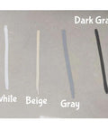 Sample markings of white, beige, gray, and dark gray colors on a surface, demonstrating grout renewal pen options.