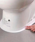 Person applying Heavy Duty PVC Sealing Tape For Kitchen Sink And Bathroom Waterproof Oil Proof Caulk Strip to toilet base.