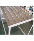 6 Pcs One Inch Flange Mount Ball Transfer Bearings With True 360 Degree Swivel Action Heavy Carbon Steel Build Ideal For Smooth Conveyor Setup Or Roller Stand Assembly Delivering Solid Four Hundred Pound Load Capacity Built Tough For Daily Shop Grind No, showing flange mount bearings on a work surface.
