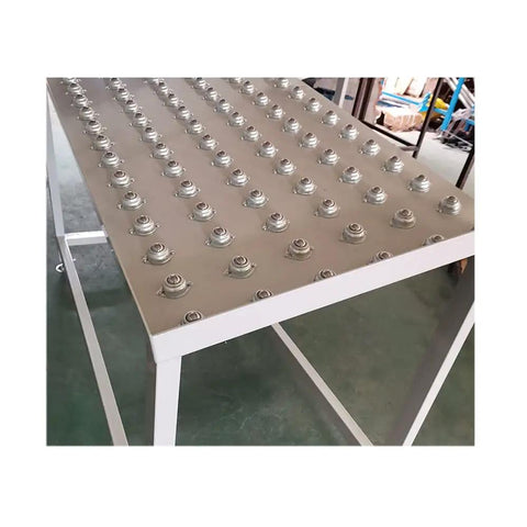 6 Pcs One Inch Flange Mount Ball Transfer Bearings With True 360 Degree Swivel Action Heavy Carbon Steel Build Ideal For Smooth Conveyor Setup Or Roller Stand Assembly Delivering Solid Four Hundred Pound Load Capacity Built Tough For Daily Shop Grind No, showing flange mount bearings on a work surface.
