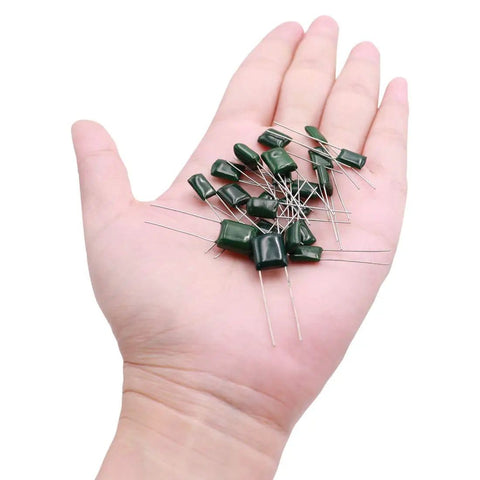 Hand holding Assortment Kit Of Metalized Mylar Polyester Film Capacitors, 375 Pcs, 24 Values From 0.22nF To 470nF, 100V DC, In A Box