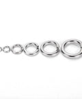 Set of stainless steel split lock washers in graduated sizes; 6 pieces shown.