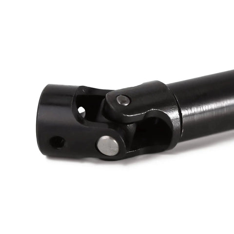 Close-up of Durable CNC Hardened Steel Drive Shaft Upgrade for SCX24 Gladiator Dodge Power Wagon 1 24 RC with black finish and logo etched.