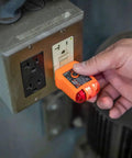 Person using RT210 Outlet Tester For GFCI And Standard Receptacles Easy Electrical Safety Check For Homeowners on wall outlet