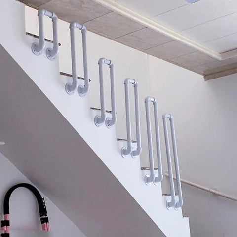 Tough As Nails Industrial Pipe Railing Featuring Slick Non Slip Iron Guardrail for indoor stairs with white iron tubes.