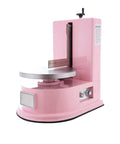 Smooth Operator Automatic Cake Cream Smoothing Machine With Button Press Controls And Custom Thickness Adjustments For Show Stopping Frosting Finishes Lightweight Pink Tool at an angle showing its design and features.