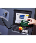 Top Tier Vibration Analyzer With Built In Laser Tachometer measuring acceleration, velocity near a control panel.
