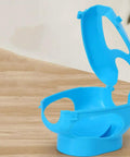 Sky-blue Pigeon Injection Holder And Fixed Frame Rack for Easy Feeding and Quick Observation on wooden surface.