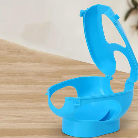 Sky-blue Pigeon Injection Holder And Fixed Frame Rack for Easy Feeding and Quick Observation on wooden surface.