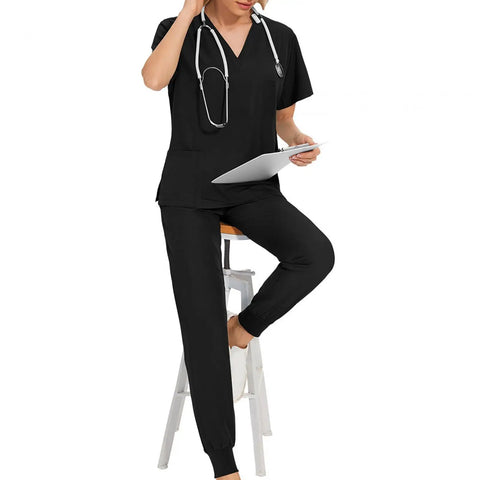 Women's Scrubs Set Top and Jogger Pants for Spa Beauty Workwear, Nurse Uniform in Black, XXL, worn by model sitting on a stool