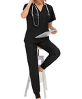Women's Spa Scrubs Set With Top And Jogging Pants, Machine Washable Nurse Workwear, Black Uniform, Size L, sitting on stool