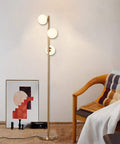 Three Globe Brushed Brass Floor Lamp, Modern LED Standing Light For Living Room, Bedroom, And Office, room setting