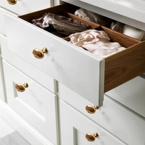 Golden Wave Shaped Cabinet Pulls Set Of 6 With Glossy Cupboard Drawer Knobs on white drawer in kitchen