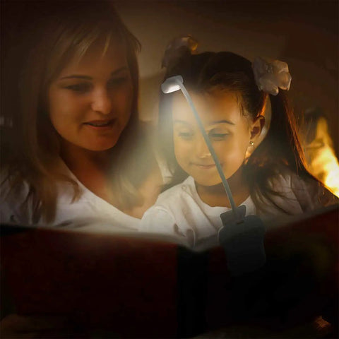 Mother and daughter reading with Warm 3000K LED Rechargeable Clip On Reading Light in dimly lit room.