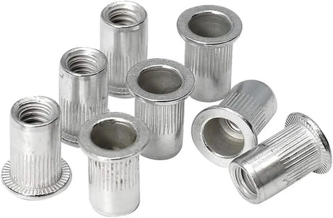 Close-up of 120 Piece Aluminum Rivet Nut Set 1/4-20 UNC Rivnuts Nutserts for auto and home projects, showing threaded anchors.