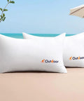 Set Of 2 12x20 Inch Outdoor Waterproof Throw Pillow Inserts for Patio illustrated by two white cushions on beach
