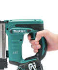 18V LXT Crown Stapler With Easy Depth Control Knob held in hand showing compact design and see-through magazine window
