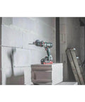 Professional Heavy Hitter 18V Brushless Cordless Hammer Drill Driver Set Includes Two 52Ah Lithium Ion Batteries Quick Charger on block.