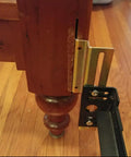 Straight Up Heavy Duty Headboard Conversion Brackets For Metal Bed Frames installed on a wooden bed post with claw hook mount