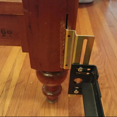 Straight Up Heavy Duty Headboard Conversion Brackets For Metal Bed Frames installed on a wooden bed post with claw hook mount