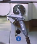 Jet Guard 74S Safety Air Blow Gun with 74S Air Cone Nozzle hanging on machinery in workshop setting.