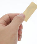 Hand holding a copper electrode strip from Copper And Zinc Electrode Strips 20 Pcs DIY Science Kit For Classrooms And Labs
