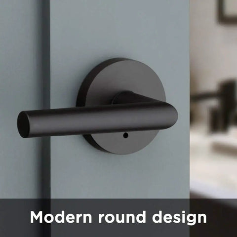 Milan Matte Black Iron Door Lever, Dope Modern Slim Round Privacy Handle installed on interior door showing modern round design.