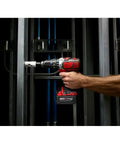 Heavy Duty Compact Hammer Drill Driver With Beefy 500 In Lbs Torque Output And Zero To One Eight Hundred Rpm Settings Featuring All Metal Gearcase Cordless Bare Tool Built Tough For Professional Jobsites in use, drilling into metal frame.