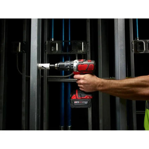 Heavy Duty Compact Hammer Drill Driver With Beefy 500 In Lbs Torque Output And Zero To One Eight Hundred Rpm Settings Featuring All Metal Gearcase Cordless Bare Tool Built Tough For Professional Jobsites in use, drilling into metal frame.