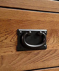 Antique Black Ring Pull Handles Set Of 4 For Dresser Cabinets Doors And Furniture Drawers close-up on wooden drawer