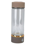 Keep It Fresh And Locked In With This Portable Hydrogen Water Bottle Featuring USB Rechargeable Tech And Stainless Steel Build For Antioxidant Rich Hydration At The Gym Or Office All Day Long - clear glass body and brown lid.