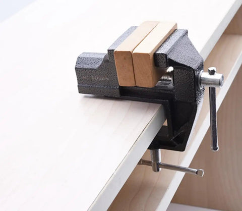 2 Inch Mini Bench Vise Beefy Heavy Duty Table Clamp With 1.20 Inch Jaw Width Anti Slip Jaws on wooden table