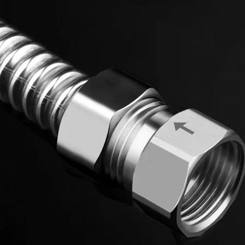 Close-up of stainless steel 1/2 in female to 1/2 in male check valve with flow arrow