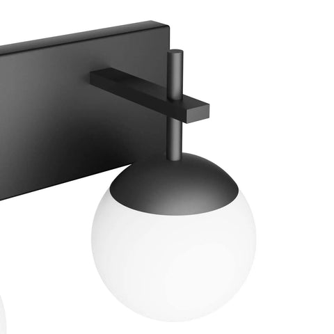 Close-up of Matte Black Two Light Bathroom Wall Light Fixtures With Milky Glass Globes, sleek mid-century modern design.