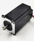Angled front view of NEMA 23 stepper motor with 8 mm shaft and 100 mm length; black housing with silver mounting flange.