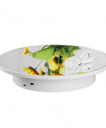 Premium Mirror White Electric Rotating Display Stand Turntable, 360 degree rotating surface with floral reflection, USB power input.