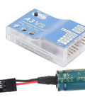 F50A 3 Axis Gyro A3 V2 Flight Controller with One Key Auto Hover next to capacitor for RC fixed wing airplanes