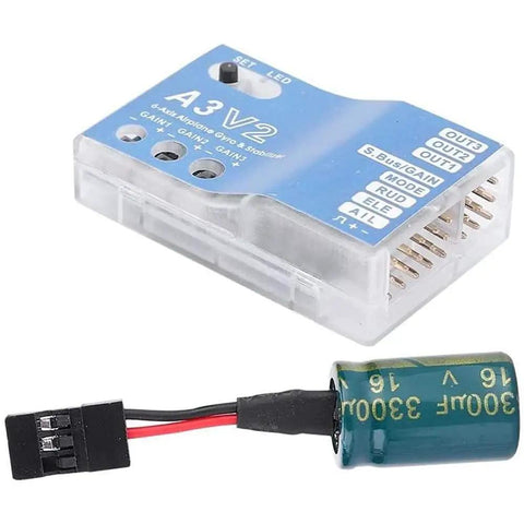 F50A 3 Axis Gyro A3 V2 Flight Controller with One Key Auto Hover next to capacitor for RC fixed wing airplanes