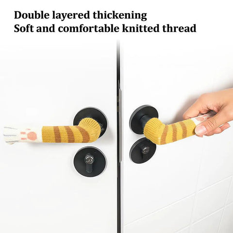 Yellow cat paw door handle cover on white door, showcasing soft, stretchy fabric with double layered thickening for soft grip.