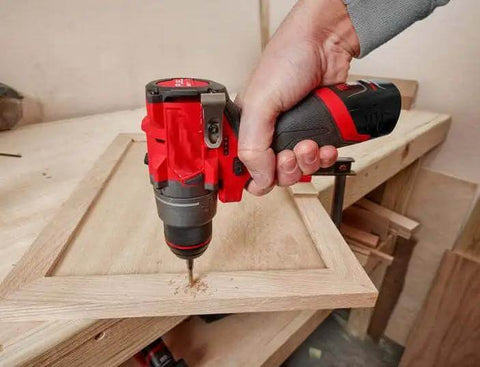 Compact 12V Cordless Drill Driver Kit With Brushless Motor and Heavy Grip Chuck Compatible With Milwaukee M12 Fuel Models in use.