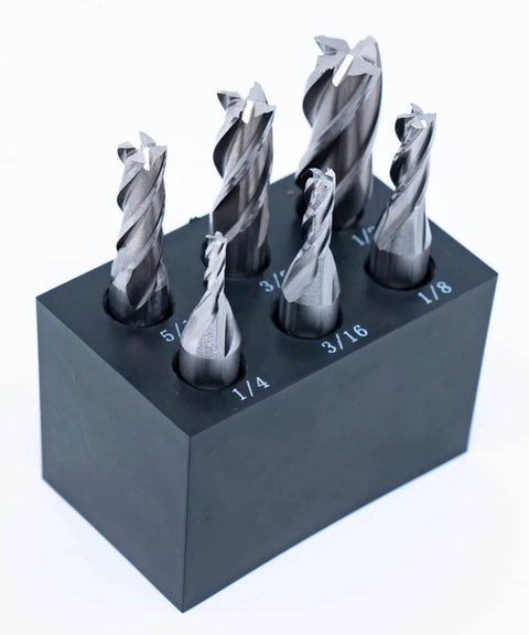 Front view of six end mills in a black plastic stand; 3/8 in shank; sizes 1/8–1/2 in.