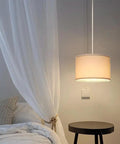Plug And Play Pendant Light With Smart Color Changing Bulb And Wireless Remote Hanging Lamp For Farmhouse Decor Game Changer Lighting For Living Room And Bedroom Super Chill Setup above a nightstand in a cozy bedroom.