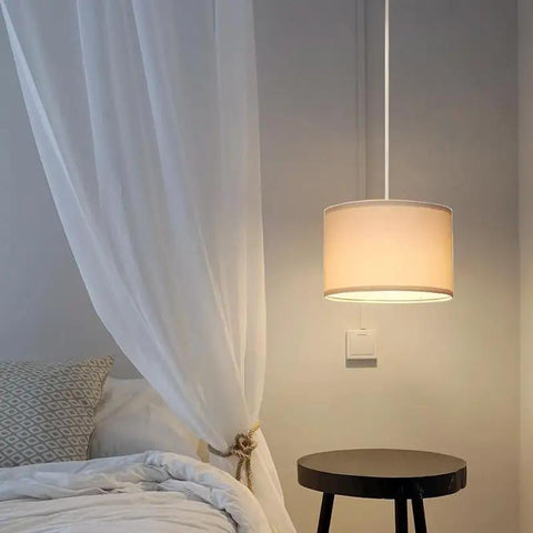 Plug And Play Pendant Light With Smart Color Changing Bulb And Wireless Remote Hanging Lamp For Farmhouse Decor Game Changer Lighting For Living Room And Bedroom Super Chill Setup above a nightstand in a cozy bedroom.