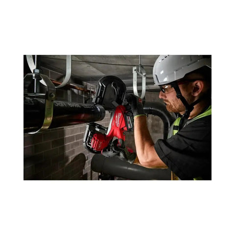 Worker using M18 Fuel Deep Cut Band Saw With Powerstate Brushless Motor Delivers 550 SFPM For Heavy Duty Metal Cutting Lightweight Design Reduces Fatigue Up To 78 Cuts Per Charge In 1 5 8 Inch Unistrut 5 Inch By 5 Inch Cut Capacity For Real World Jobs to cut metal pipe on job site.