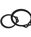 Badass Heavy Duty External Shaft Retaining Ring Assortment Kit With Premium Black Carbon Steel Circlips In Multiple Sizes and Durable Storage Case For DIY Repairs showing two black carbon steel circlips.