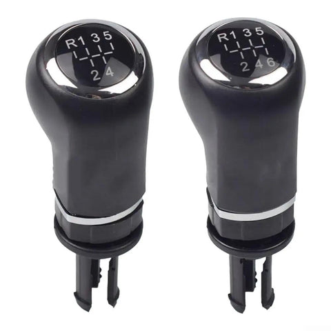 Sleek Black And Silver Manual Gear Shift Knob For Opel Cars Perfect Upgrade For 5 Or 6 Speed Manuals Simple DIY Install No Tools Needed To Spice Up Your Ride Today. Black plastic and metal manual gear shift knob for Opel 6-speed, front view on white background
