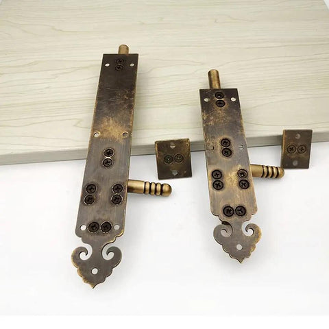 Heavy Duty Solid As A Rock Pure Copper Barrel Bolt Sliding Door Latch With Padlock, two sizes, decorative design, mounted on wood.